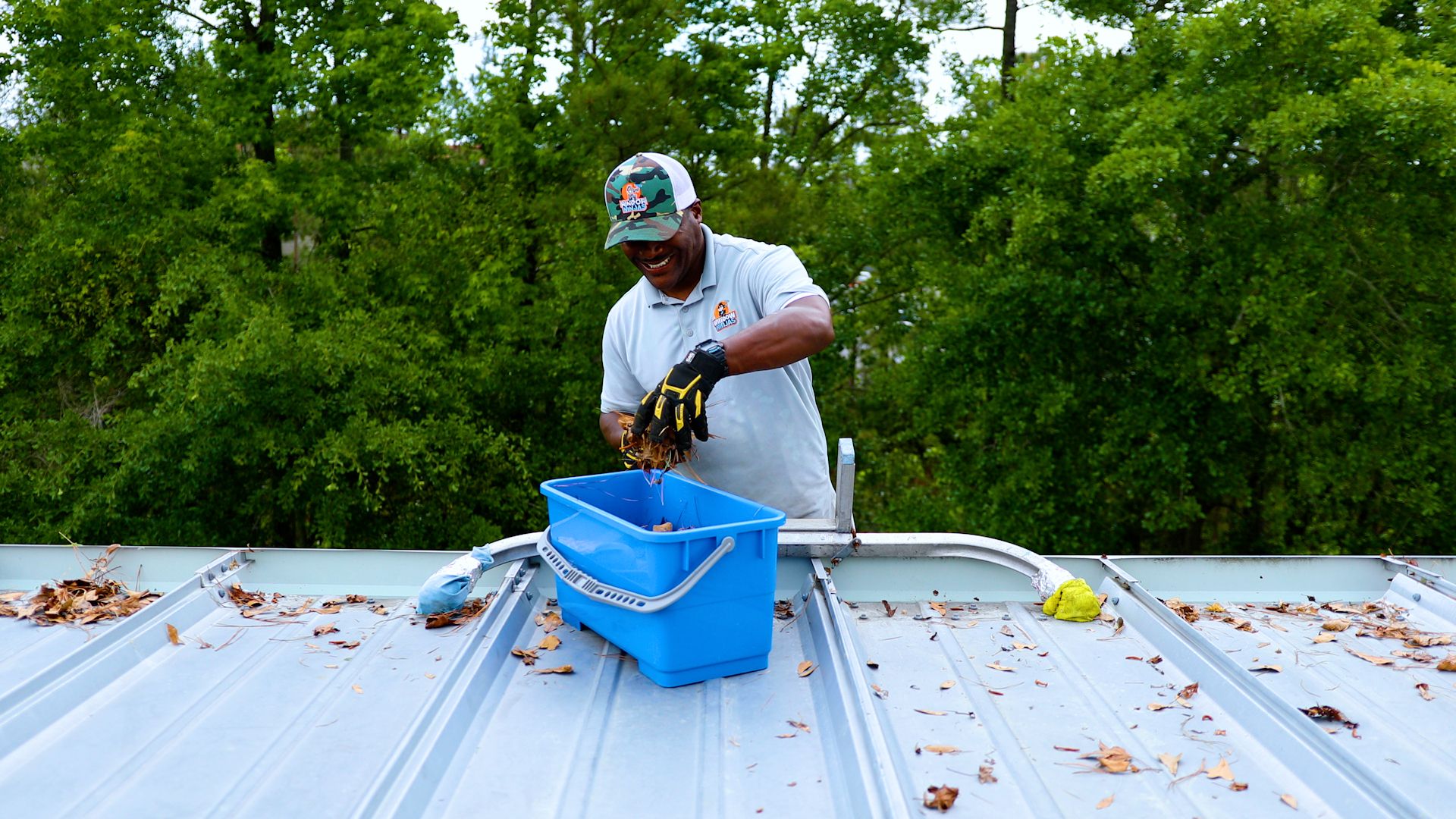 technician clean gutters