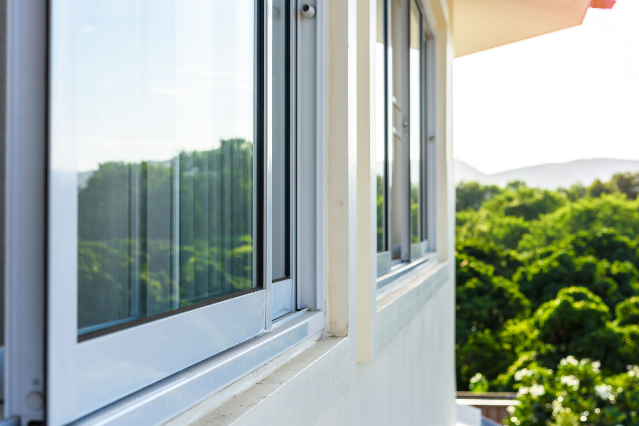 A graphic image of a window, highlight what the track is and what the sill is.
