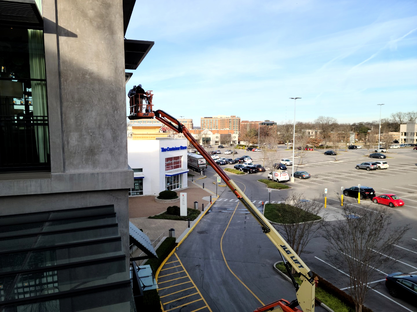 Window Ninjas cleaning the windows for a commercial building - we are a window washing and commercial pressure washing company.