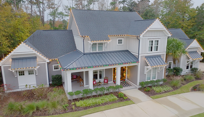 drone shot of house with holiday lights done by window ninjas