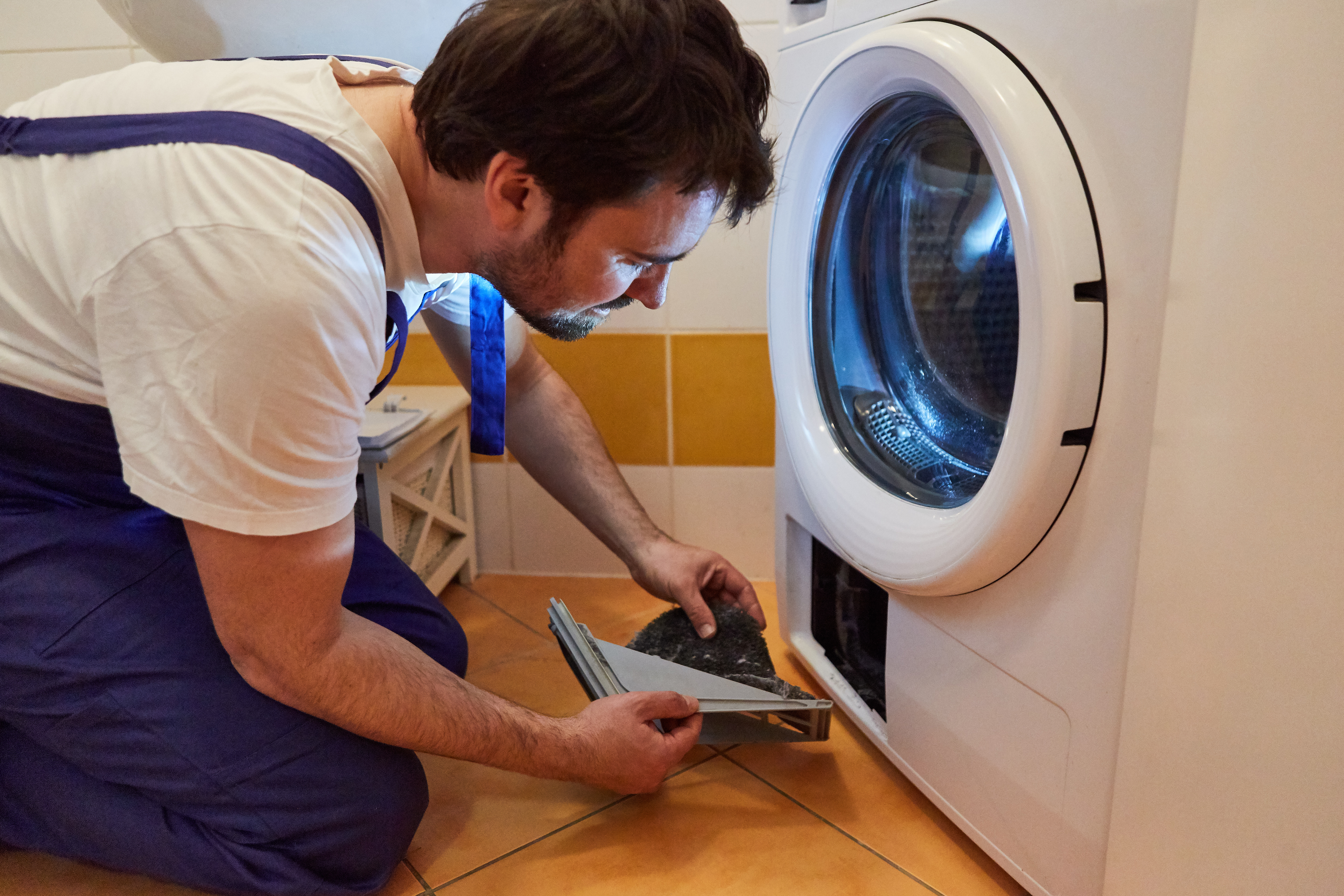 A technician from Window Ninjas starting a dryer vent cleaning job.