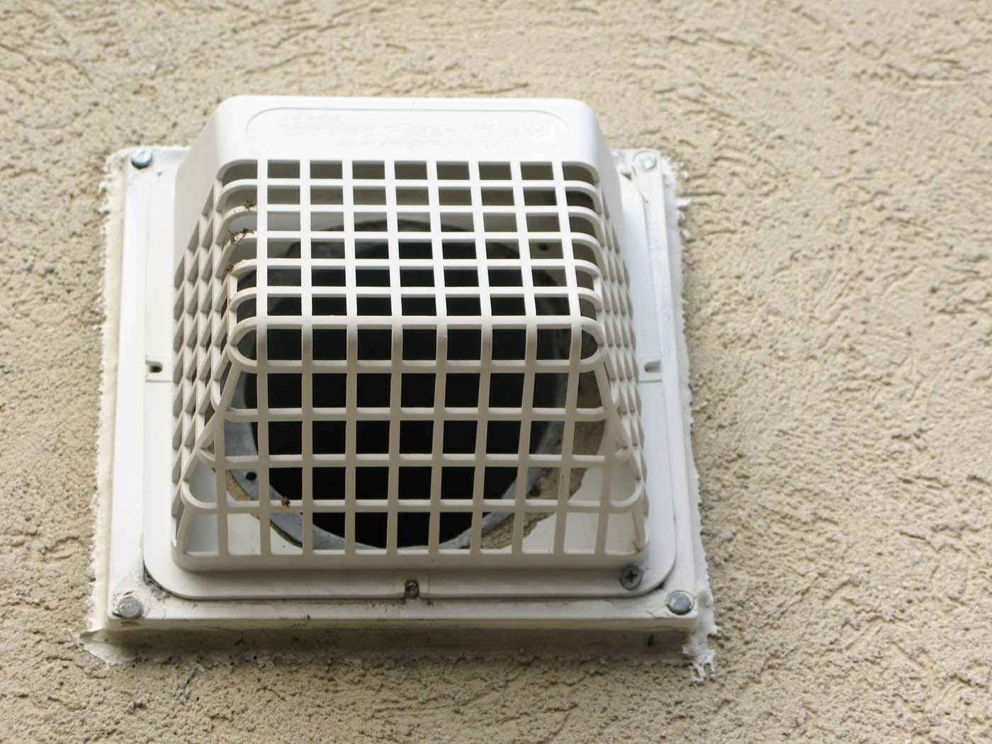 A Window Ninjas technician cleaning dryer vents in condos.