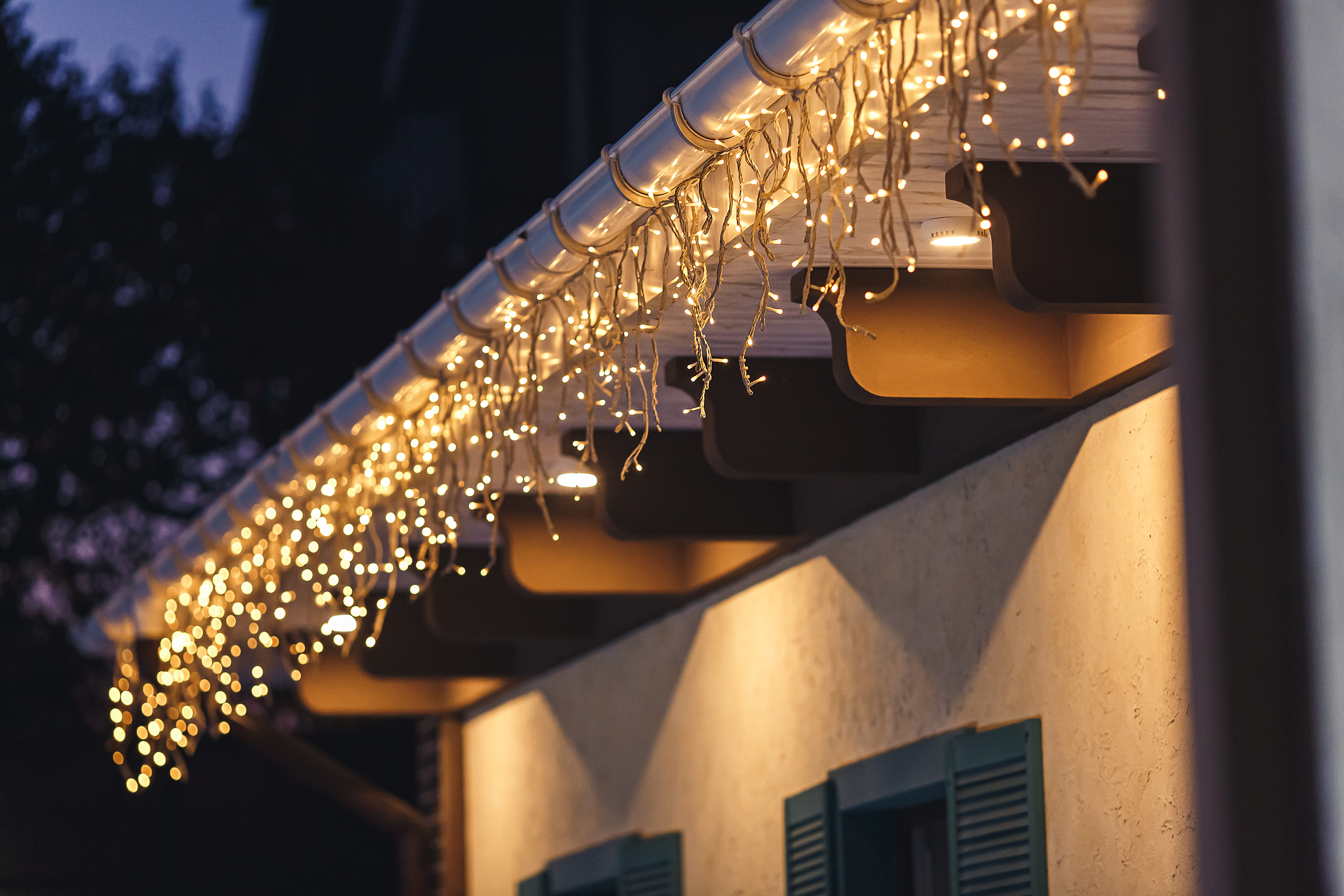 A close up shot of holiday lighting on a building - Window Ninjas offers professional commercial Christmas light installation services.