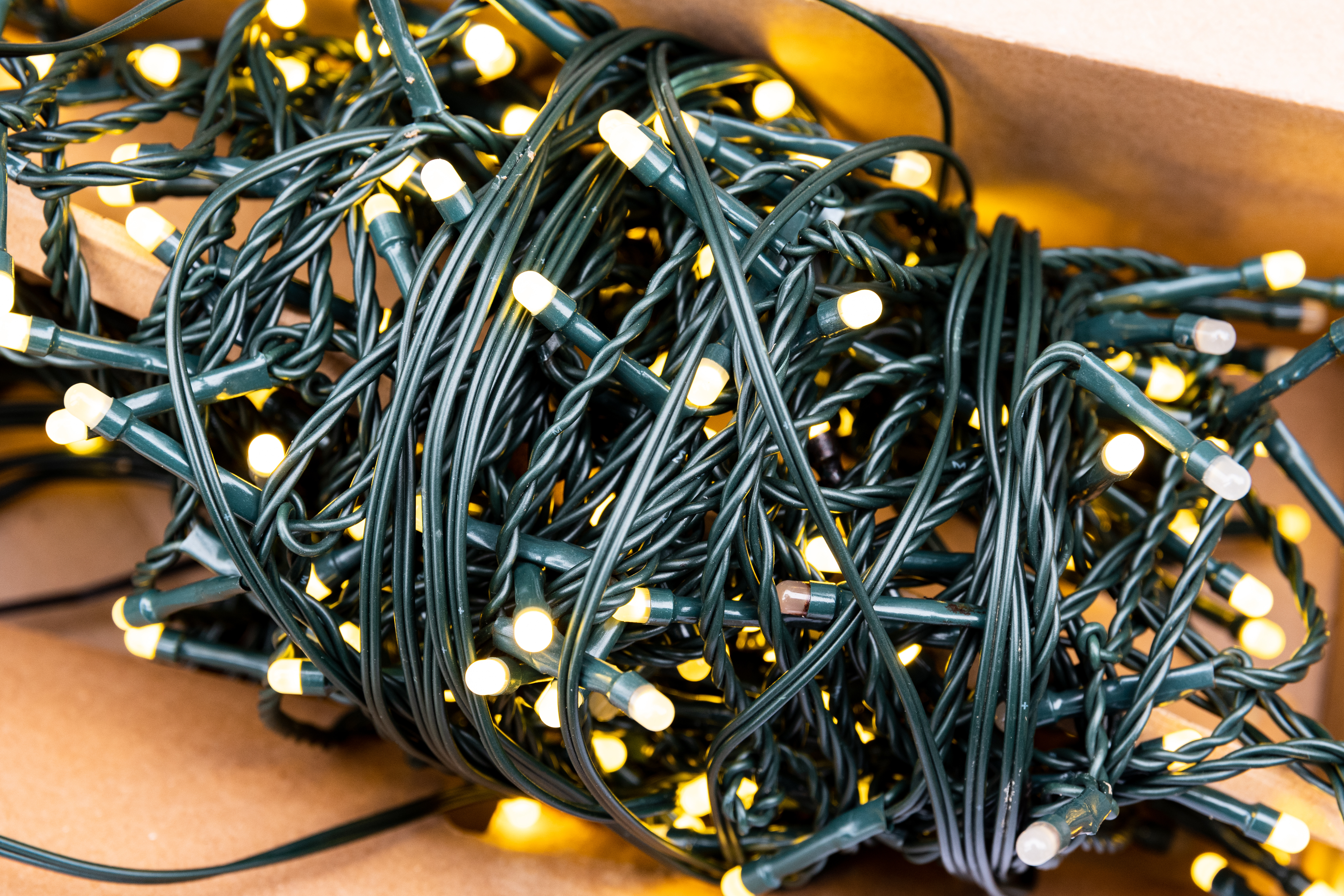 Holiday lights wound up, ready to be hung for the season - For Greenville Christmas house lights installation, contact Window Ninjas.