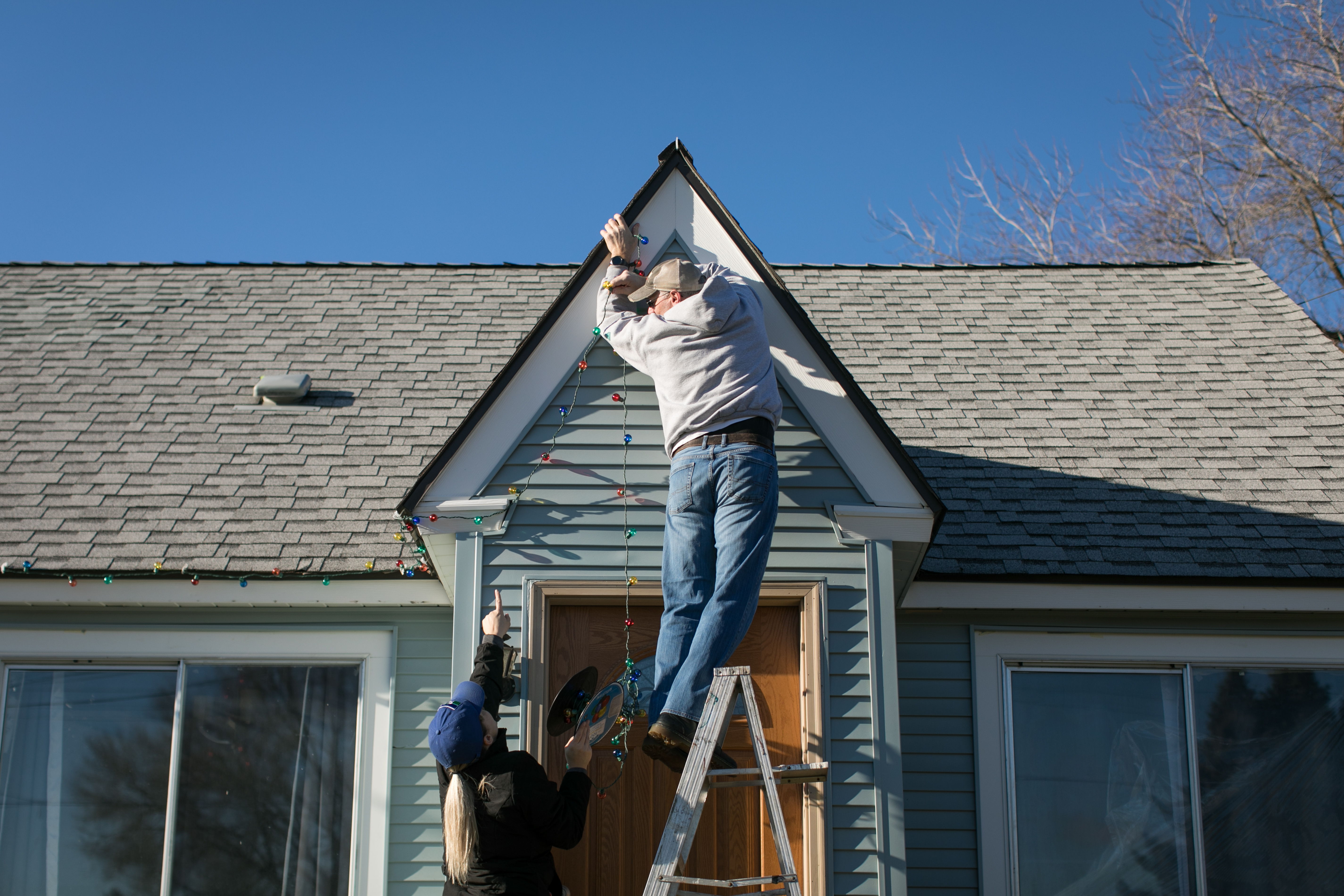 A picture of two techncians from Window Ninjas, a Christmas lighting company.