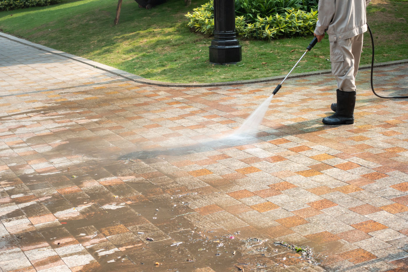 An image of someone providing pressure washing - book your pressure cleaning online with Window Ninjas today.